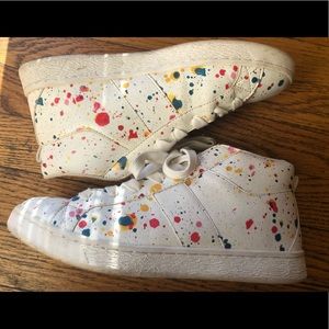 Zara white shoes with paint splatter.